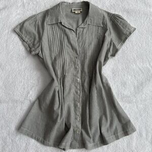 Gray and white striped button up blouse with flare at the middle